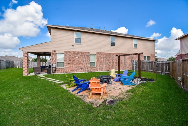 4302 Lisboa Cir, Katy, TX 77493 - rear view of property featuring a fire pit, a fenced backyard, a patio area, and brick siding