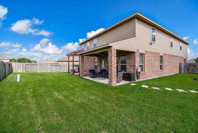 4302 Lisboa Cir, Katy, TX 77493 - back of house with an outdoor hangout area, ceiling fan, a fenced backyard, brick siding, and a patio area