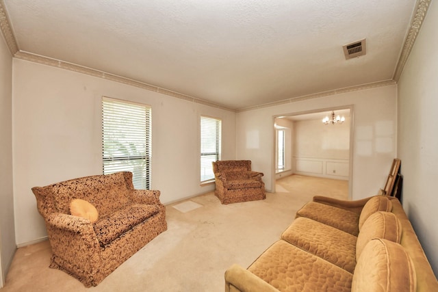 8311 Everleaf Dr, Spring, TX 77379 - living room with ornamental molding, carpet floors, and a chandelier