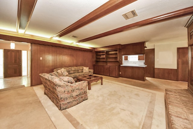 8311 Everleaf Dr, Spring, TX 77379 - living room with wooden walls, beam ceiling, and light colored carpet
