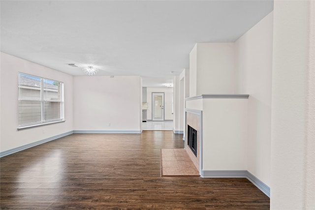 29418 Legends Hill Dr, Spring, TX 77386 - unfurnished living room featuring wood finished floors and a tile fireplace