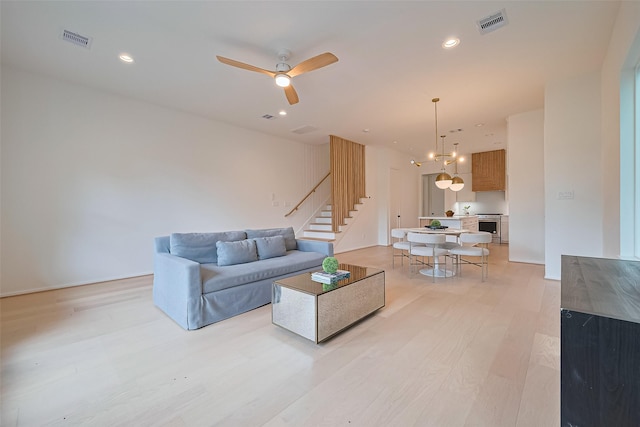 4109 Castor St Unit B, Houston, TX 77022 - living area with light wood-style flooring, stairway, ceiling fan, and recessed lighting