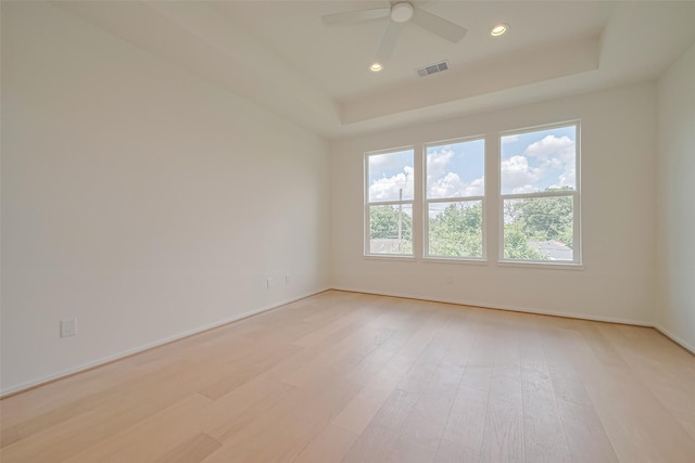 4109 Castor St Unit B, Houston, TX 77022 - unfurnished room with ceiling fan, light wood-type flooring, a tray ceiling, and recessed lighting