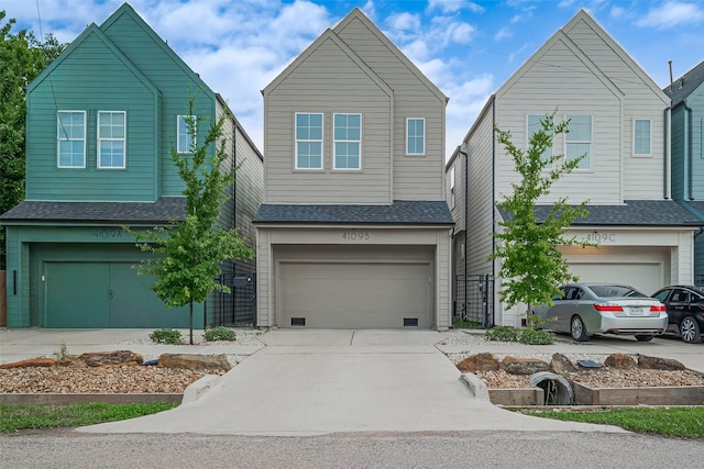 4109 Castor St Unit B, Houston, TX 77022 - view of front of home with an attached garage, concrete driveway, and roof with shingles
