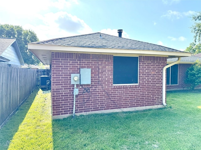 10934 Covered Bridge St, Houston, TX 77075 - view of side of home featuring brick siding and roof with shingles