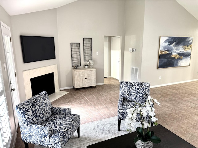 10934 Covered Bridge St, Houston, TX 77075 - living room with tile patterned floors, a fireplace, high vaulted ceiling, and plenty of natural light