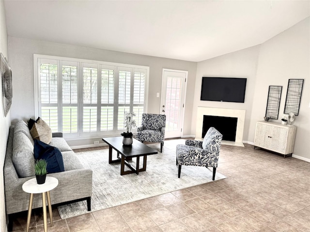 10934 Covered Bridge St, Houston, TX 77075 - living room with healthy amount of natural light, lofted ceiling, and a fireplace