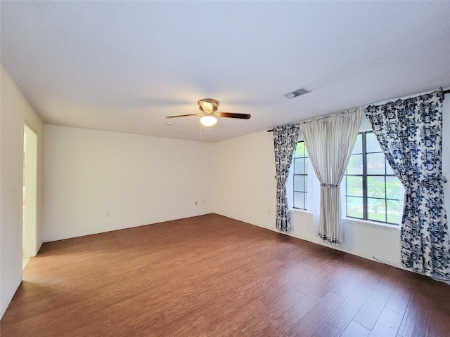 3 Thunderbird Cir, Baytown, TX 77521 - unfurnished room featuring dark wood-type flooring and ceiling fan