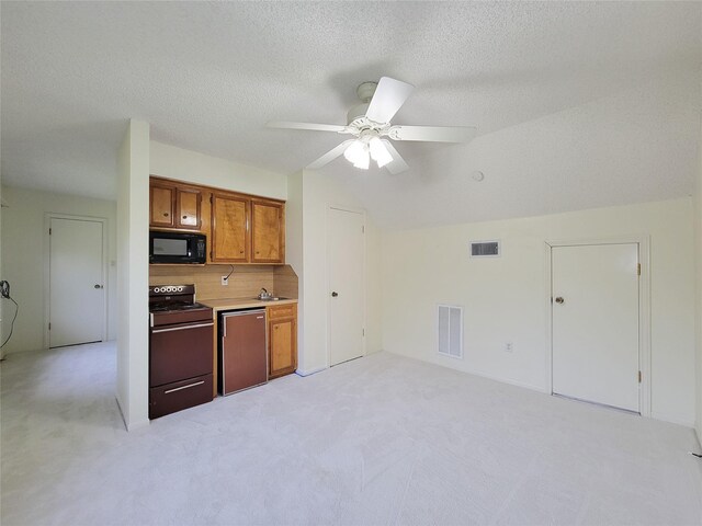 3 Thunderbird Cir, Baytown, TX 77521 - kitchen with black microwave, electric range, light colored carpet, dishwashing machine, and brown cabinetry