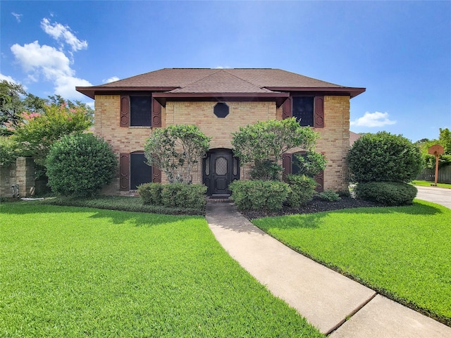3 Thunderbird Cir, Baytown, TX 77521 - view of front facade featuring a front yard, brick siding, and roof with shingles