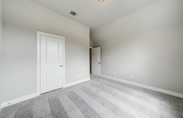 12611 Faded Sky Ct, Cypress, TX 77433 - unfurnished bedroom featuring carpet floors and vaulted ceiling