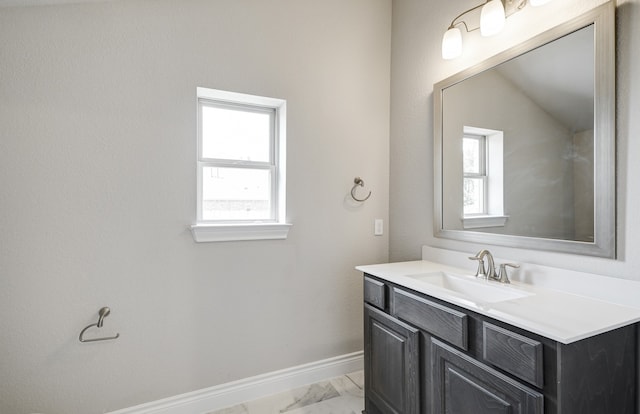 12611 Faded Sky Ct, Cypress, TX 77433 - bathroom featuring vanity, marble finish floors, and healthy amount of natural light