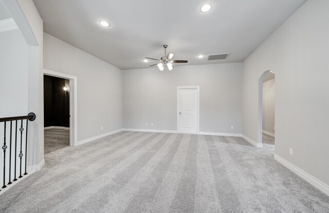 12611 Faded Sky Ct, Cypress, TX 77433 - spare room featuring ceiling fan, light colored carpet, arched walkways, and recessed lighting