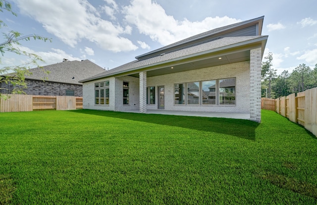 12611 Faded Sky Ct, Cypress, TX 77433 - rear view of house with brick siding and a fenced backyard