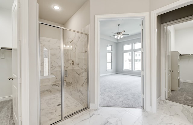 12611 Faded Sky Ct, Cypress, TX 77433 - full bathroom with ceiling fan, marble finish floors, a marble finish shower, a walk in closet, and recessed lighting