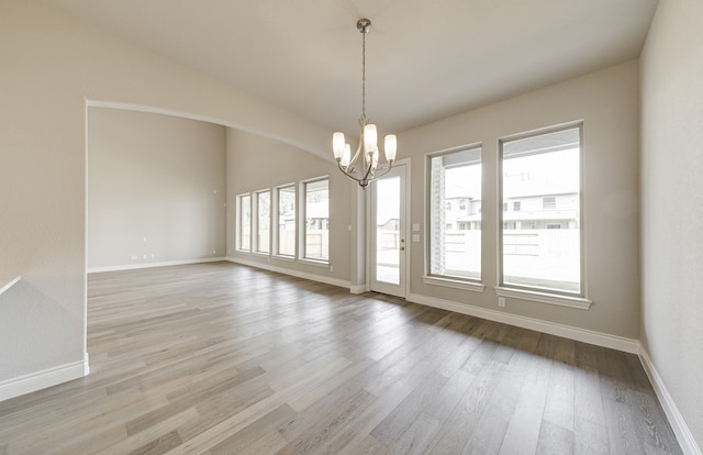 12611 Faded Sky Ct, Cypress, TX 77433 - empty room featuring a chandelier and light wood-type flooring