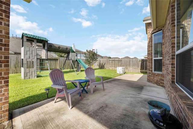 29903 Tallow Grove Ln, Brookshire, TX 77423 - fenced backyard featuring a playground and a patio