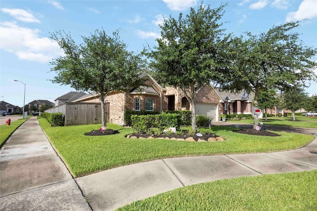 29903 Tallow Grove Ln, Brookshire, TX 77423 - view of property hidden behind natural elements featuring brick siding, a garage, and driveway