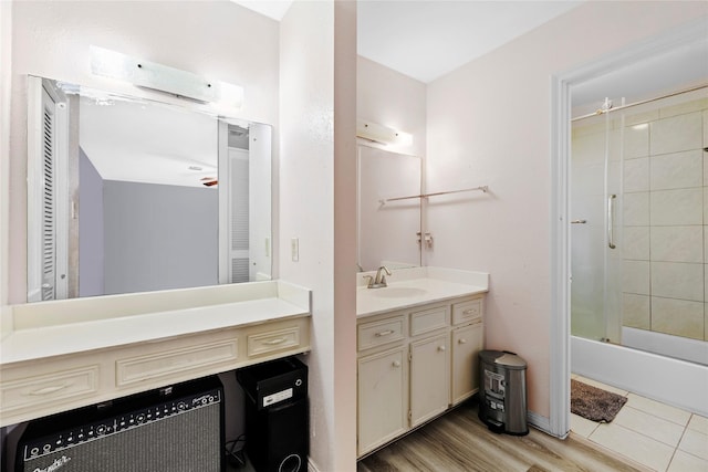 726 Park Knoll Ln, Katy, TX 77450 - bathroom with vanity, shower / bathtub combination, and wood finished floors