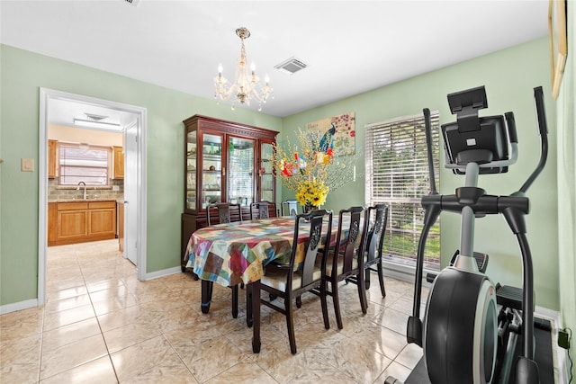 726 Park Knoll Ln, Katy, TX 77450 - dining room featuring healthy amount of natural light, a chandelier, and light tile patterned floors