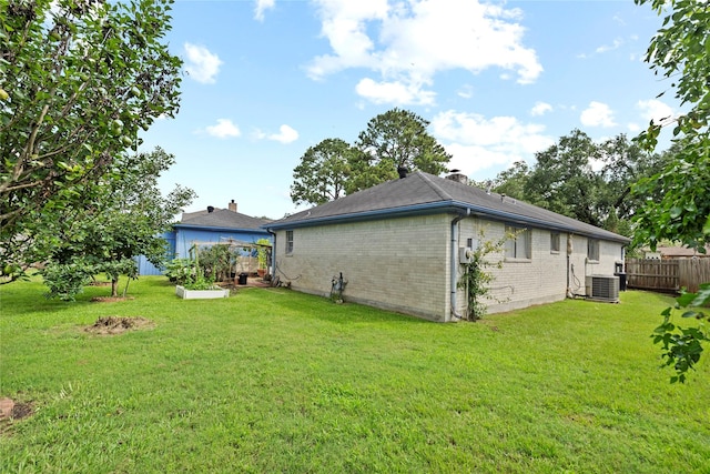 726 Park Knoll Ln, Katy, TX 77450 - back of house with brick siding and a chimney
