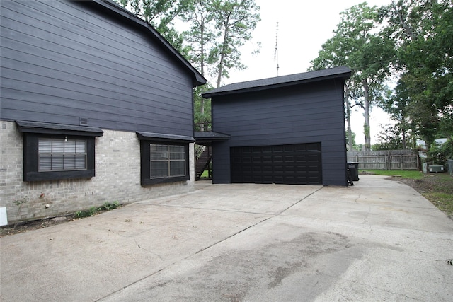 12611 Old River Dr, Baytown, TX 77523 - view of property exterior featuring brick siding and a detached garage