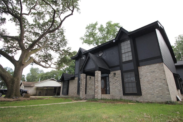 12611 Old River Dr, Baytown, TX 77523 - view of front facade with brick siding and a front yard