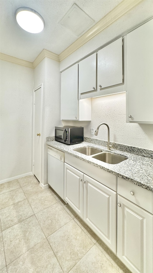 7900 N Stadium Dr Unit 53, Houston, TX 77030 - kitchen with black microwave, white dishwasher, light tile patterned floors, ornamental molding, and light stone countertops
