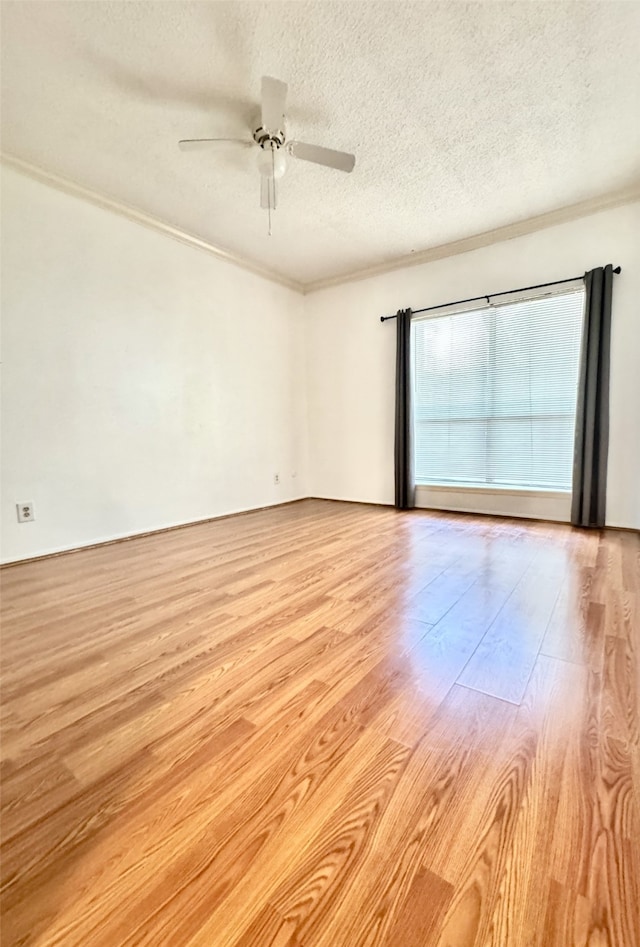 7900 N Stadium Dr Unit 53, Houston, TX 77030 - empty room with a textured ceiling, ceiling fan, light wood-style flooring, and crown molding