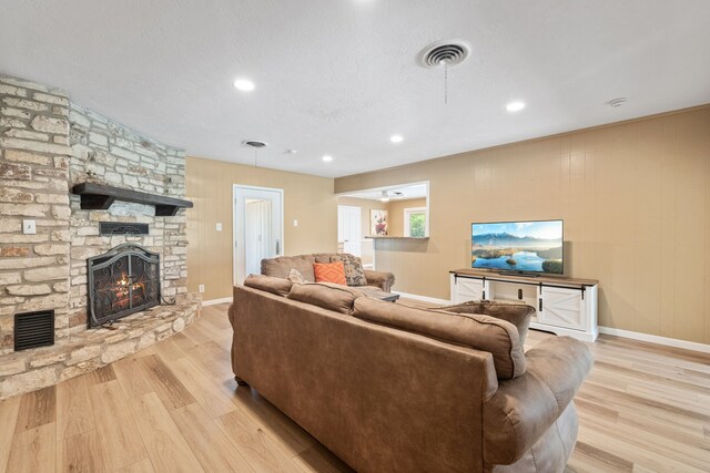 5254 State Highway 146 S, Livingston, TX 77351 - living area with a stone fireplace, wood finished floors, and recessed lighting