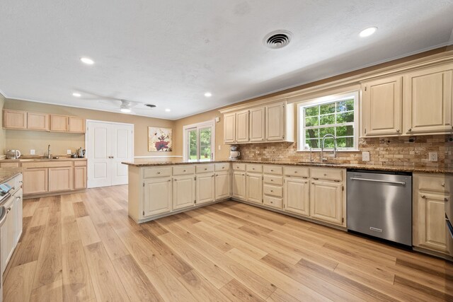 5254 State Highway 146 S, Livingston, TX 77351 - kitchen with dishwasher, a peninsula, light wood finished floors, light brown cabinetry, and recessed lighting