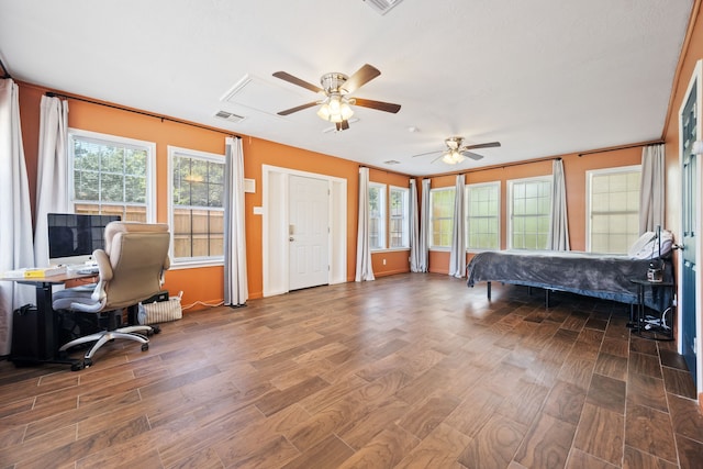 5254 State Highway 146 S, Livingston, TX 77351 - bedroom featuring wood finished floors, attic access, a desk, and a ceiling fan