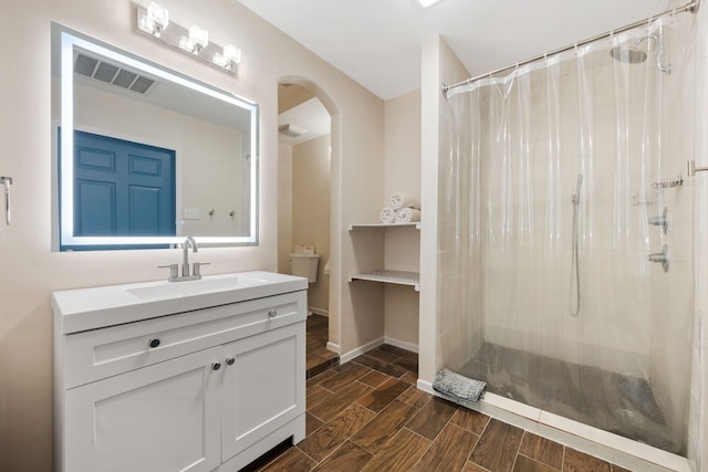 5254 State Highway 146 S, Livingston, TX 77351 - full bathroom with curtained shower, vanity, and wood tiled floors