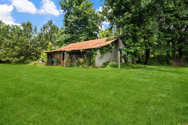 5254 State Highway 146 S, Livingston, TX 77351 - view of grassy yard with an outbuilding and a pole building