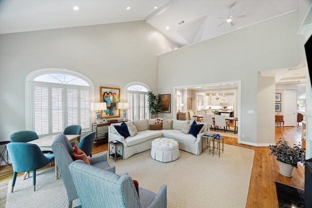 333 Sugarberry Cir, Houston, TX 77024 - living room with light wood-style flooring, high vaulted ceiling, and ceiling fan