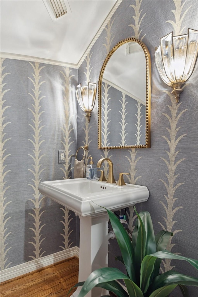 333 Sugarberry Cir, Houston, TX 77024 - bathroom with wallpapered walls, wood finished floors, and crown molding