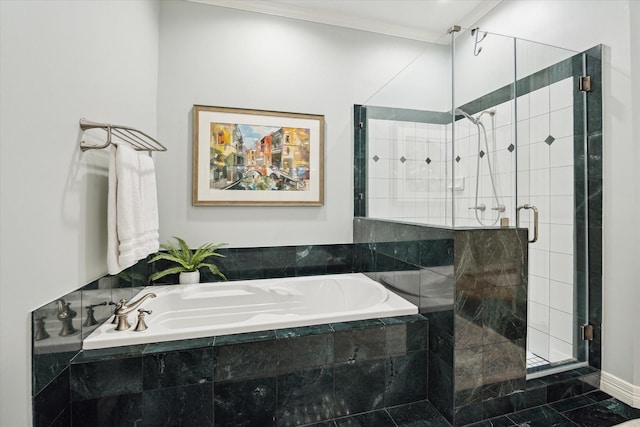 333 Sugarberry Cir, Houston, TX 77024 - bathroom featuring a bath, a shower stall, and ornamental molding