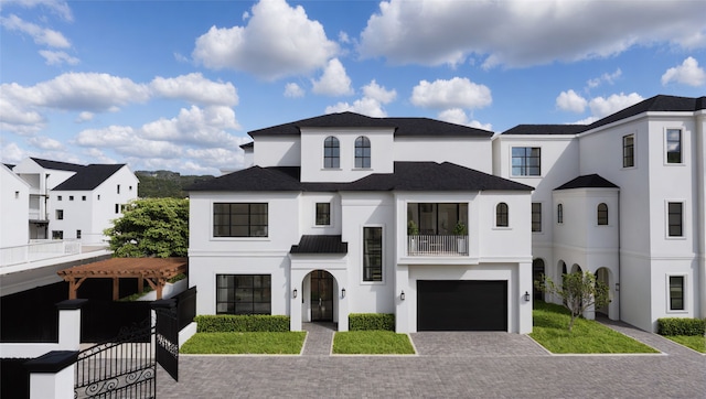 1919 Potomac Dr, Houston, TX 77057 - view of front of home featuring stucco siding, decorative driveway, a balcony, and an attached garage