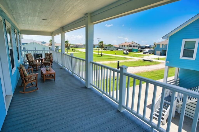 2028 County Road 201, Sargent, TX 77414 - wooden porch with a residential view and a lawn