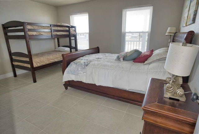 2028 County Road 201, Sargent, TX 77414 - tiled bedroom featuring baseboards