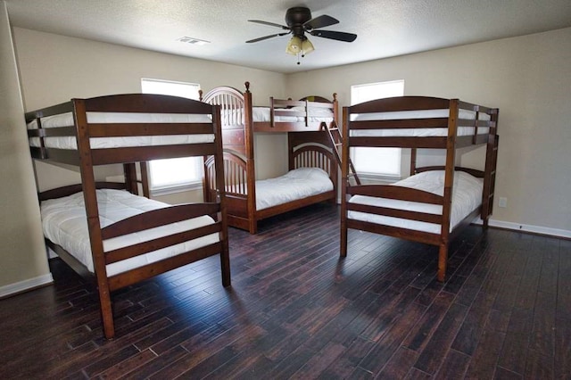 2028 County Road 201, Sargent, TX 77414 - bedroom featuring wood finished floors and ceiling fan