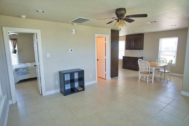 2028 County Road 201, Sargent, TX 77414 - dining room with ceiling fan and light tile patterned floors