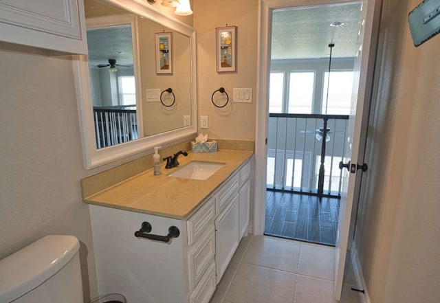 2028 County Road 201, Sargent, TX 77414 - half bath with vanity, a ceiling fan, and tile patterned flooring