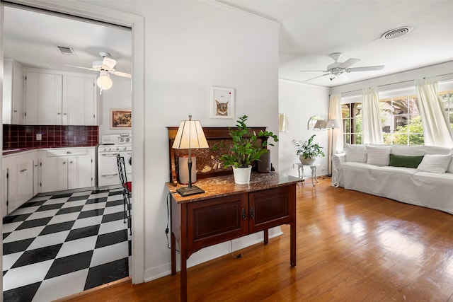 2114 Saxon Dr, Houston, TX 77018 - living room with ceiling fan, crown molding, and wood finished floors