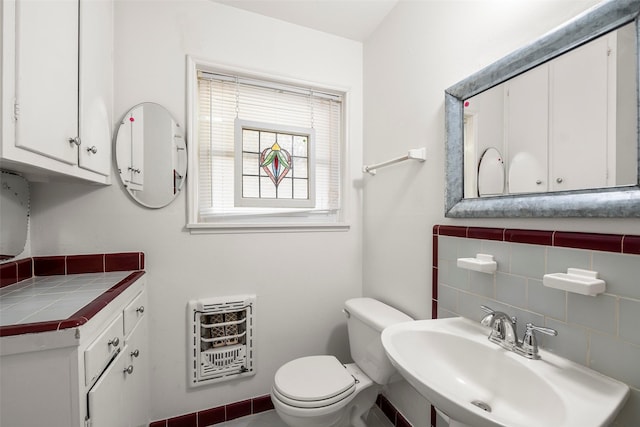 2114 Saxon Dr, Houston, TX 77018 - bathroom with heating unit and a sink