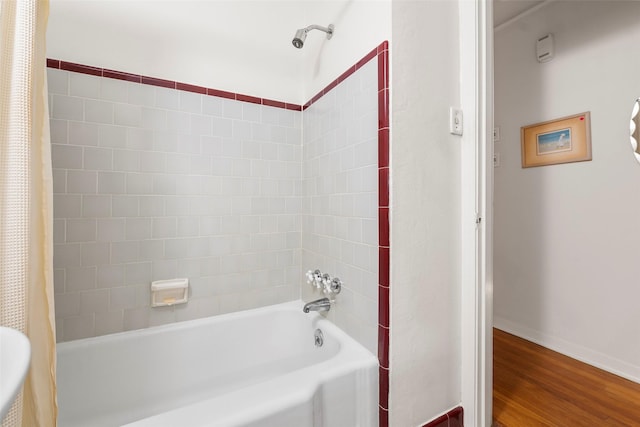 2114 Saxon Dr, Houston, TX 77018 - bathroom with shower / tub combo and wood finished floors
