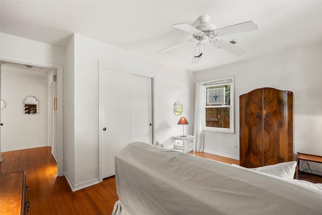 2114 Saxon Dr, Houston, TX 77018 - bedroom featuring a closet, hardwood / wood-style flooring, ceiling fan, and attic access