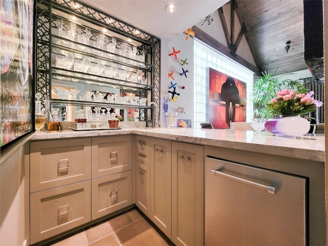 3124 Mid Ln, Houston, TX 77027 - indoor bar featuring lofted ceiling, stainless steel dishwasher, and tile patterned floors