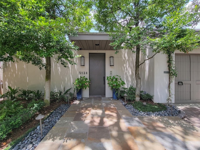 3124 Mid Ln, Houston, TX 77027 - view of exterior entry featuring stucco siding
