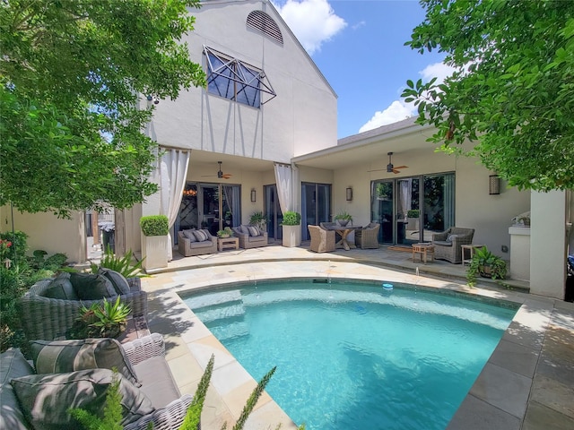 3124 Mid Ln, Houston, TX 77027 - rear view of property featuring ceiling fan, an outdoor living space, stucco siding, and an outdoor pool